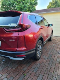 the rear end of a red honda cr - v